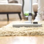 vacuuming carpet